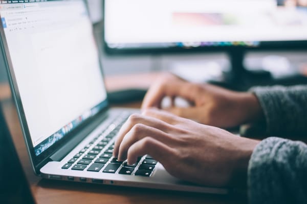 Close up of someone using laptop