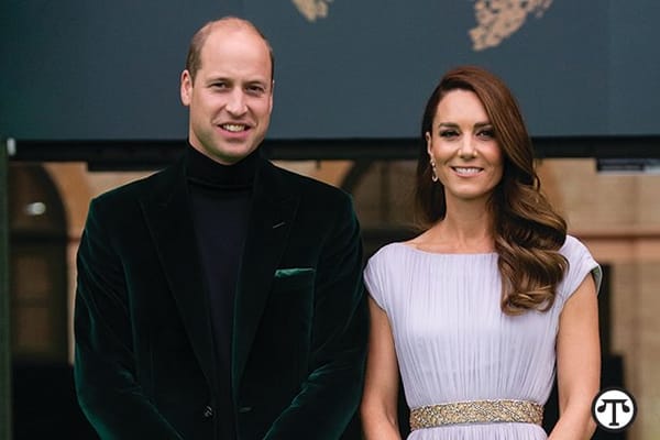 Prince william and kate middleton pose for a photo.