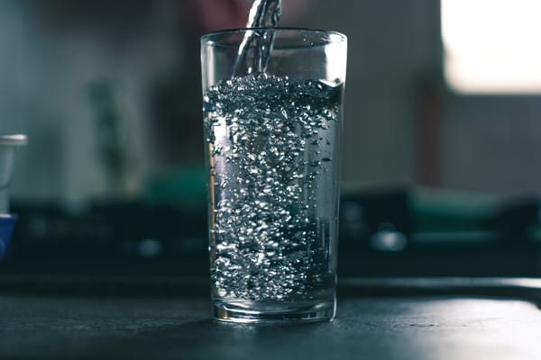 Water being poured into a glass.